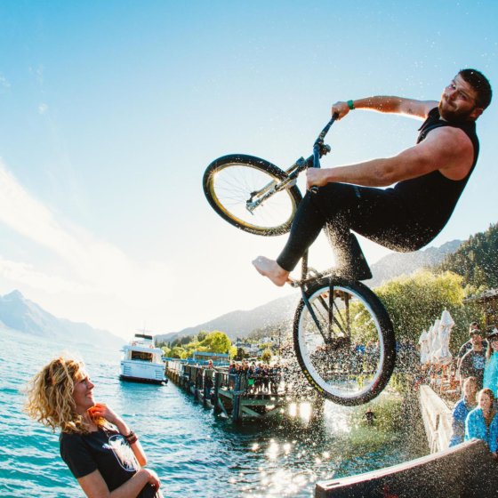 Flipping into the Queenstown Lake on his bike