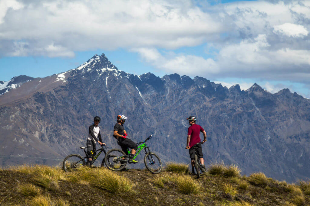 Bikers riding Queenstown mountain bike trail Rude Rock