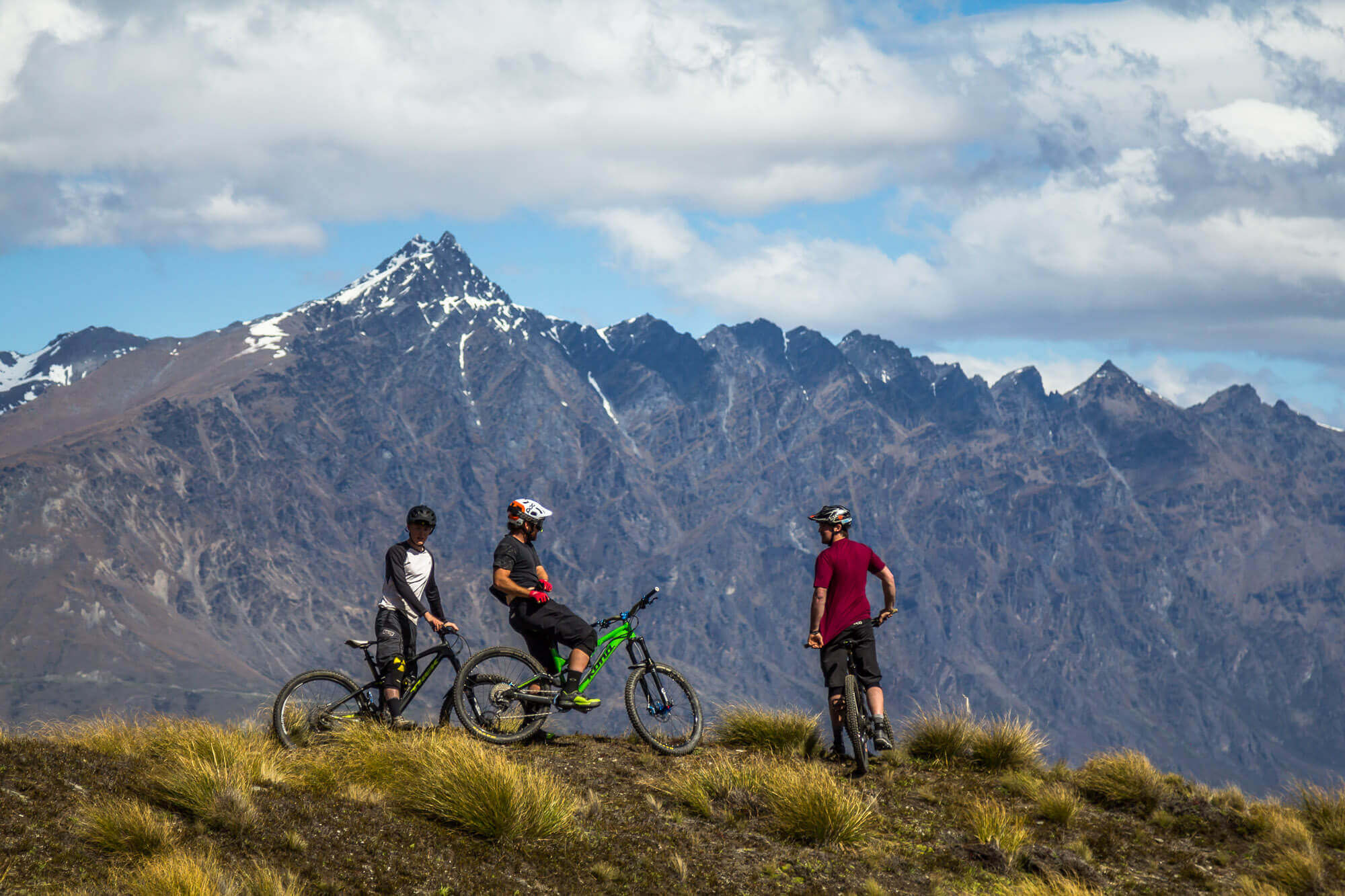 Bikers riding Queenstown mountain bike trail Rude Rock