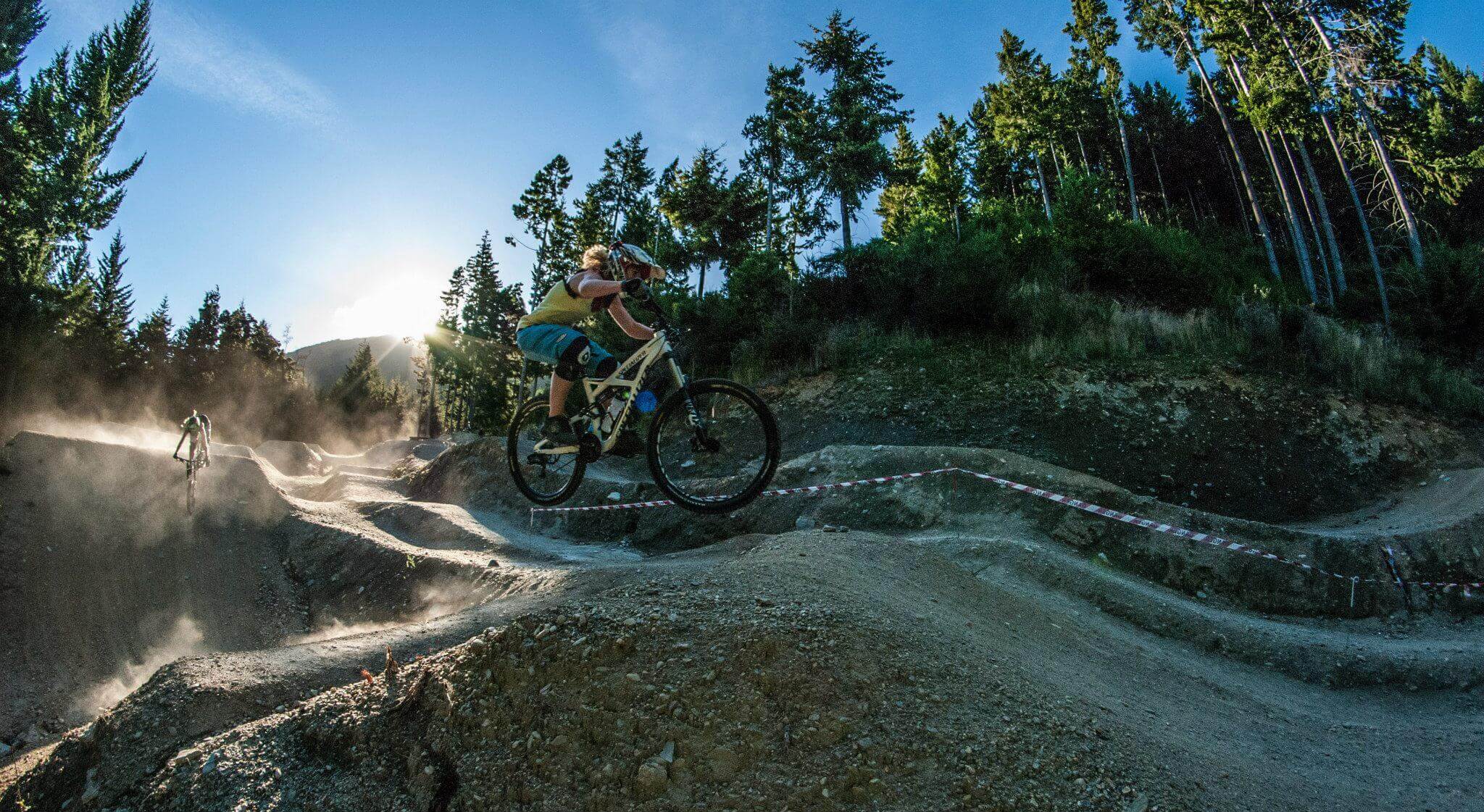 Amy jumping Wynyard mini dream trail, Queenstown